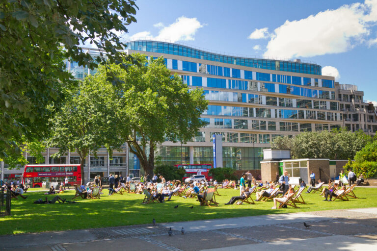 City workers enjoy the sunshine on Finsbury Square in the City of London
